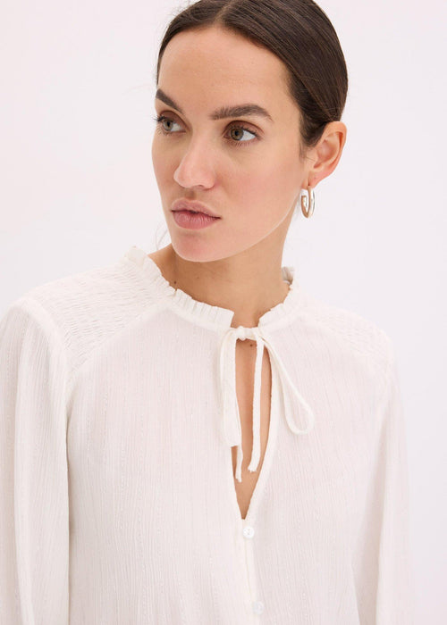 Bluza s metaliziranim prugama