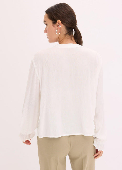 Bluza s rupičastim vezom