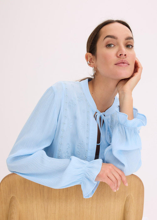 Bluza s rupičastim vezom